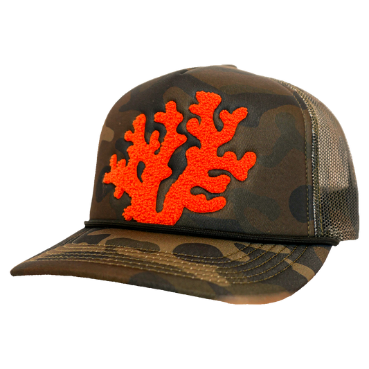 Camouflage cap with orange coral design on a white background