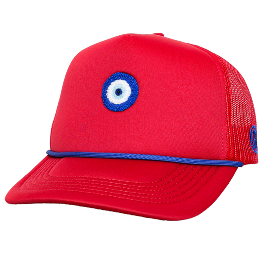 Red cap with a blue and white eye emblem on a white background