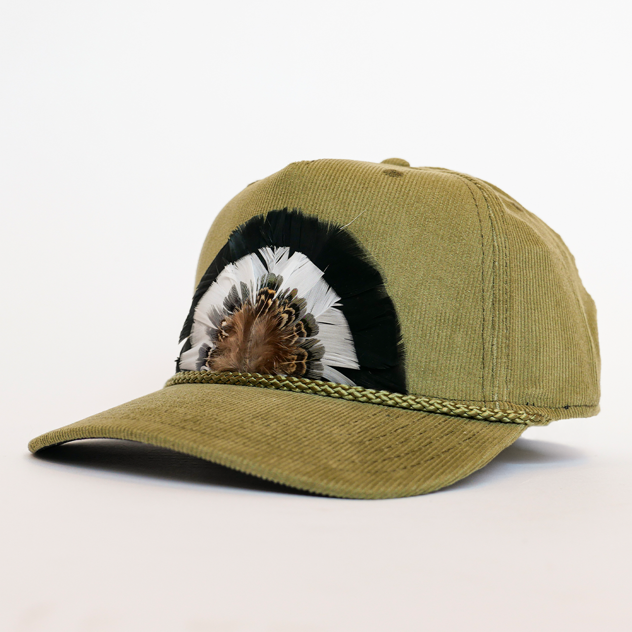 Green cap with feather design on a white background
